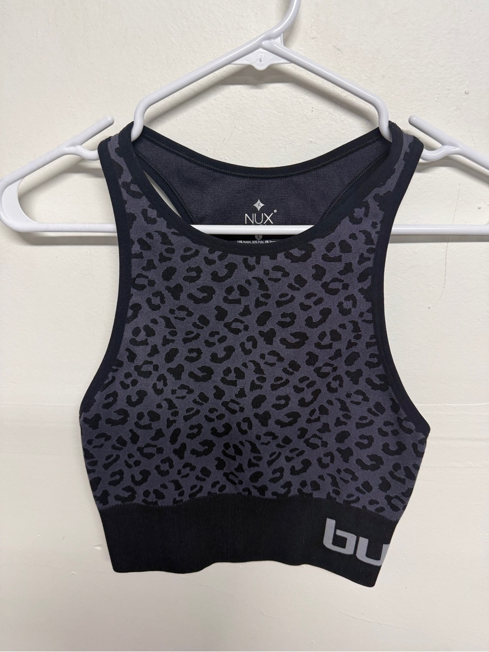 NUX "One By One" sports bra in black featuring a leopard animal print Size Small